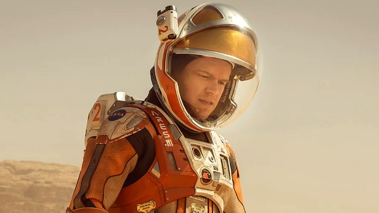 Matt Damon's Mark Watney sits on Mars' sand dunes in The Martian