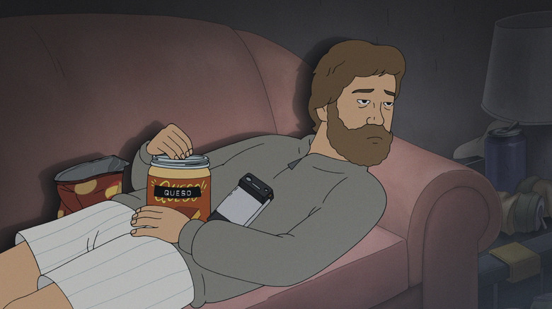 Jeff Cooper eating chips with queso on his couch with a sad look on his face in Fired on Mars