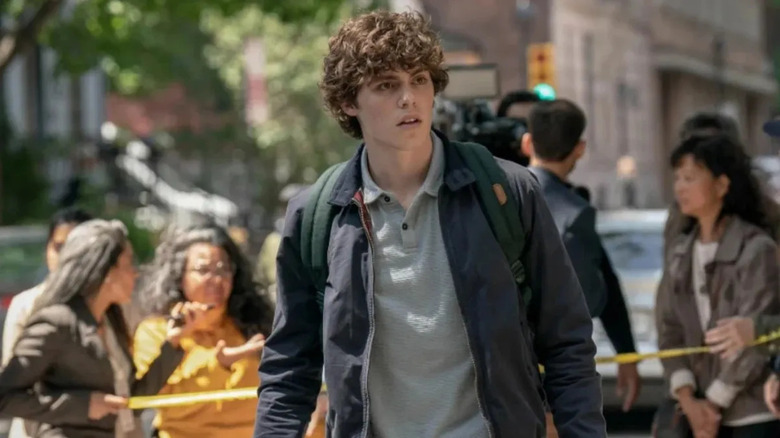 Ethan Landry with reporters behind him in Scream VI