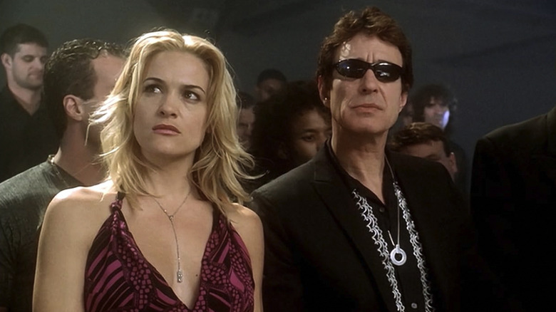 Shalimar Fox and Adam Kane stand next to each other in a crowded room in Mutant X