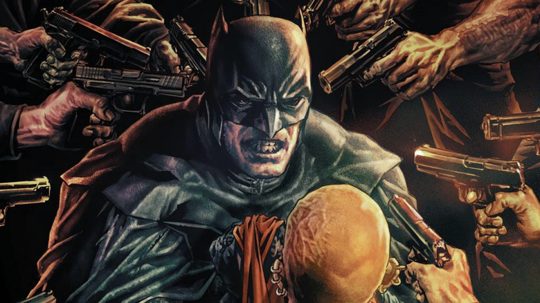 Batman is surrounded goons pointing pistols at his head in Batman Damned #1