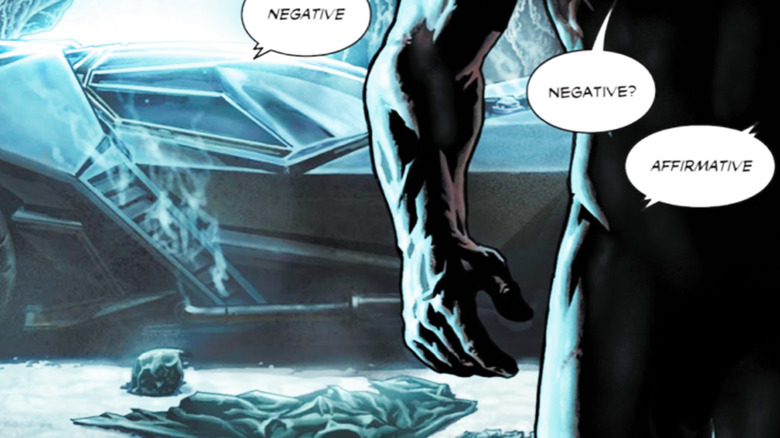 Bruce Wayne walks away from the Batmobile in a panel from Batman Damned