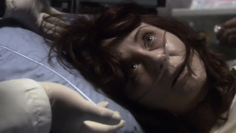 Battlestar Galactica - sick Laura Roslin lying in hospital bed