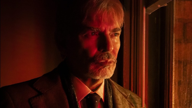 Billy looking out the window at Goliath