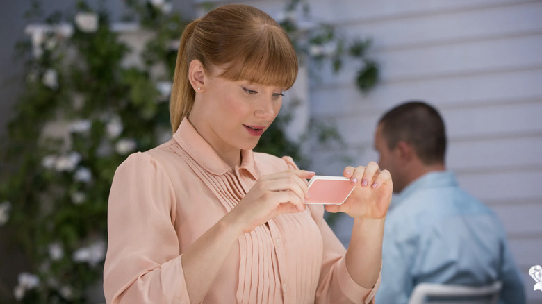 Lacie taking a photo of her breakfast in Nosedive