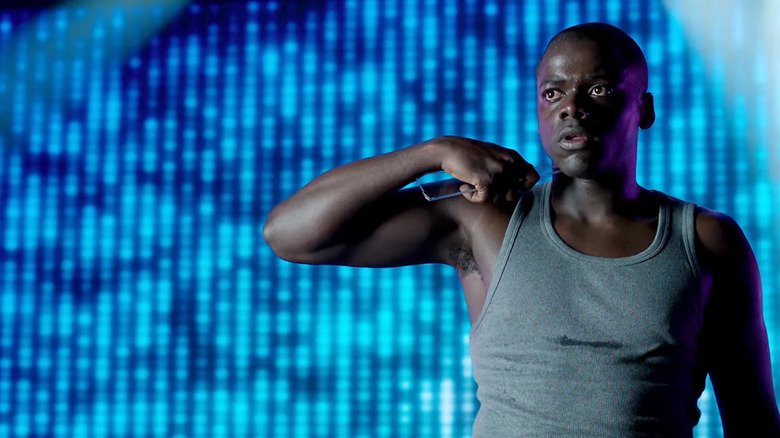 Bing holding a shard of glass to his neck on Black Mirror