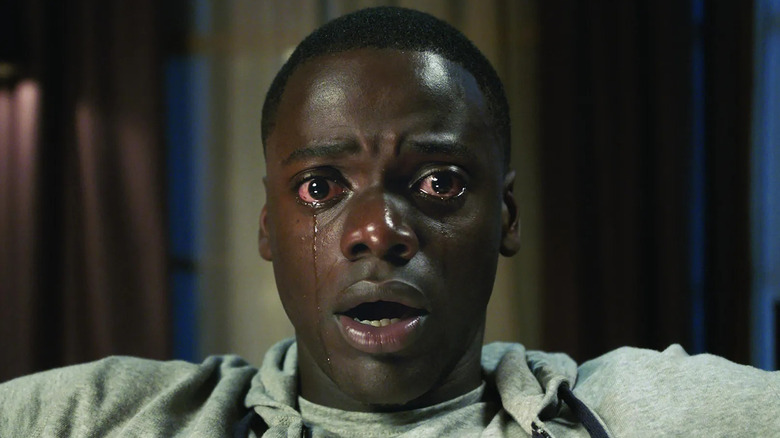 Chris with two tears streaming down his face in Get Out