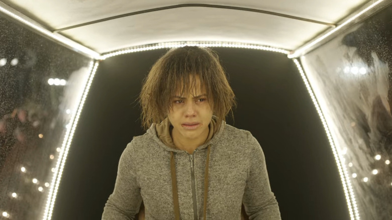 Victoria is held in a transparent container in the black ring of the black mirror