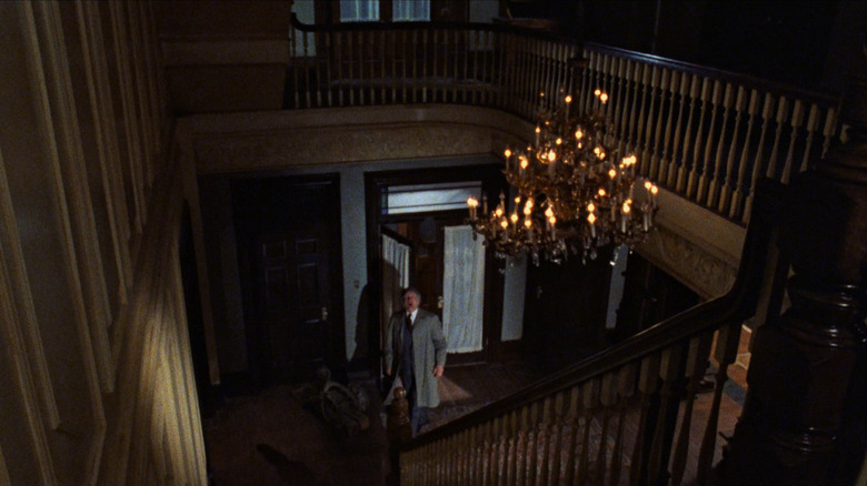 John Russell looks upstairs in The Changeling