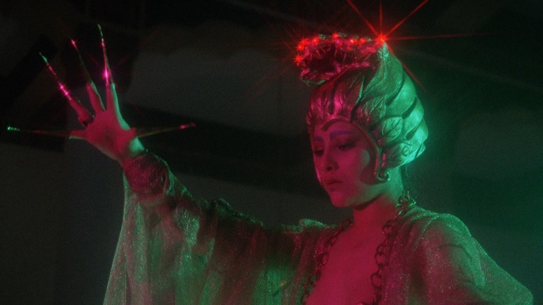 A sorceress with long claws and a headdress in The Boxer's Omen