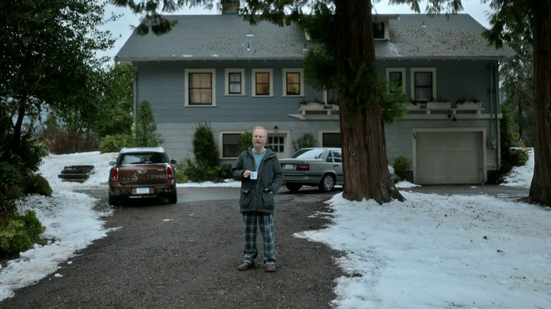 Bob Odenkirk as Hank standing in his driveway in Lucky Hank