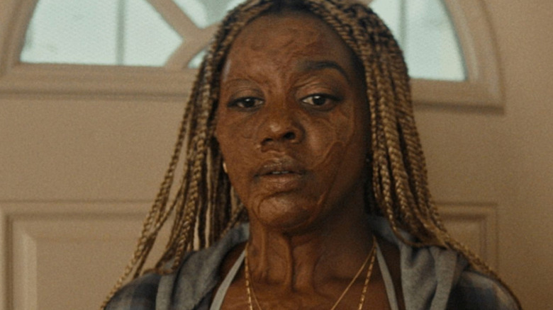 Mallori Johnson as Anaia bears facial scarring from a fire in Is God Is