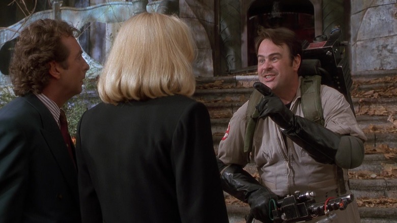 Carrigan and Paul looking at Ray Stantz outside of a house in Casper