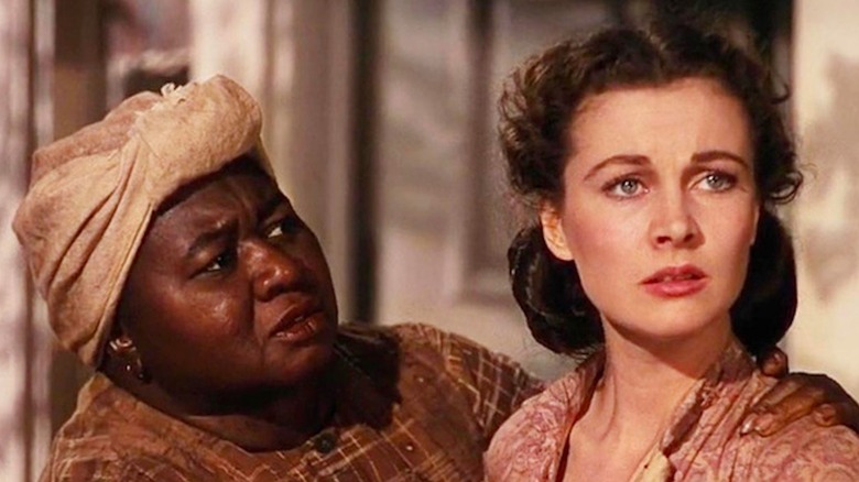 Hattie McDaniel as Mammy tends to Vivien Leigh as Scarlett O'Hara in Gone with the Wind