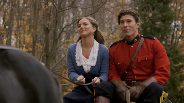 Cindy Busby's Nora Anderson rides on a horse drawn cart with Christopher Russell's Michael Fletcher in When Hope Calls
