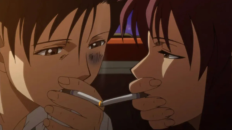 Rock and Revy kiss with their cigarettes in Black Lagoon