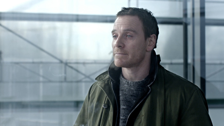 Michael Fassbender's Harry Hole stands red eyed in The Snowman