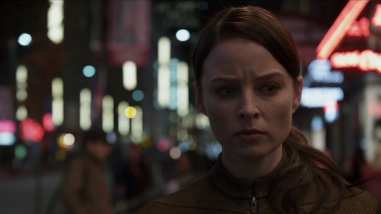 Rachel Nichols' Kiera Cameron walks down a city street in Continuum