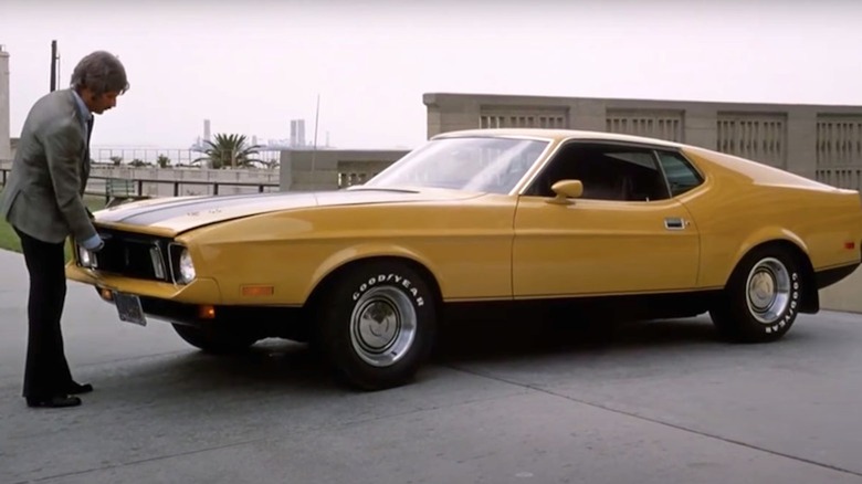 H.B. Halicki as Maindrian Pace beholds a yellow Ford Mustang named Eleanor in Gone in 60 Seconds