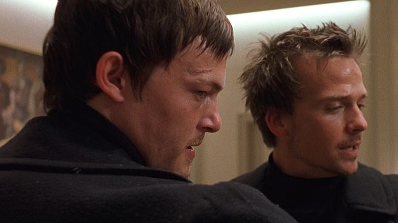 Murphy (Norman Reedus) and Connor (Sean Patrick Flannery) standing next to each other in 
