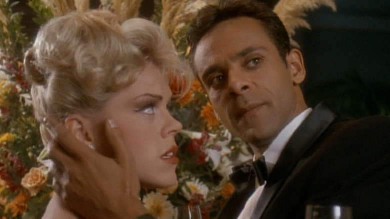 Dr. Julian Bashir in a tuxedo with a Bond girl-esque woman in the holosuite in Star Trek: Deep Space Nine