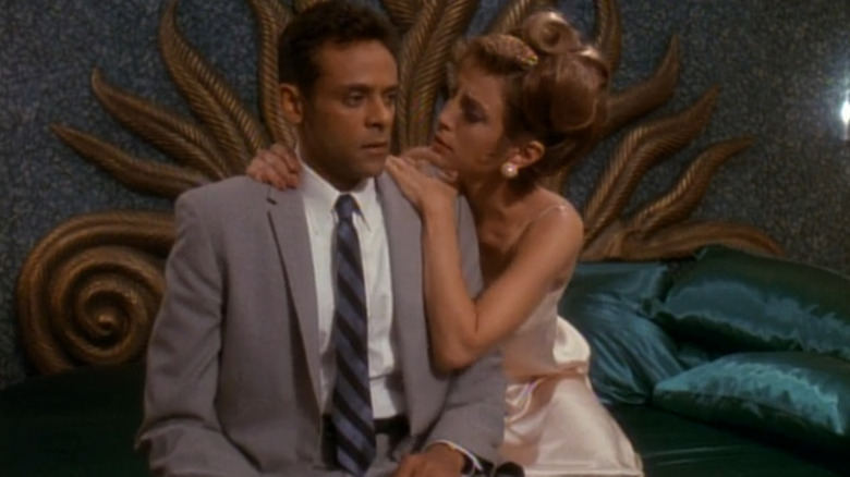 Alexander Siddig as Julian Bashir being comforted by Nana Visitor as Kira Nerys in 1960s lingerie on Star Trek: Deep Space Nine