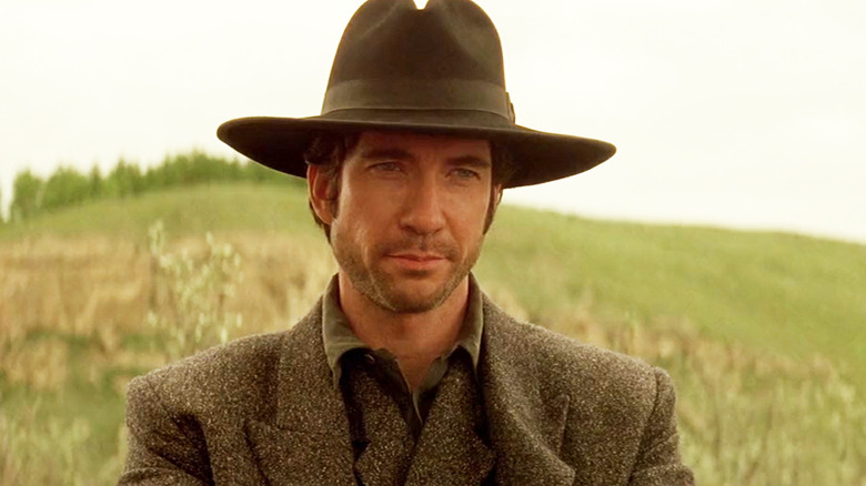 Dylan McDermott's Captain Leander McNelly is seen in closeup as he stands in front of a hill in Texas Rangers.jpg