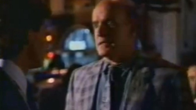 Stanley Poochinski in human form talking to Detective McKay on Poochinski