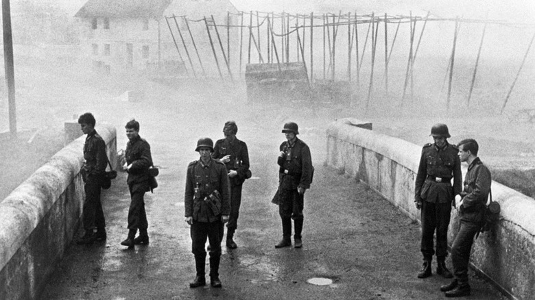 Seven teen Nazi soldiers on a bridge in The Bridge