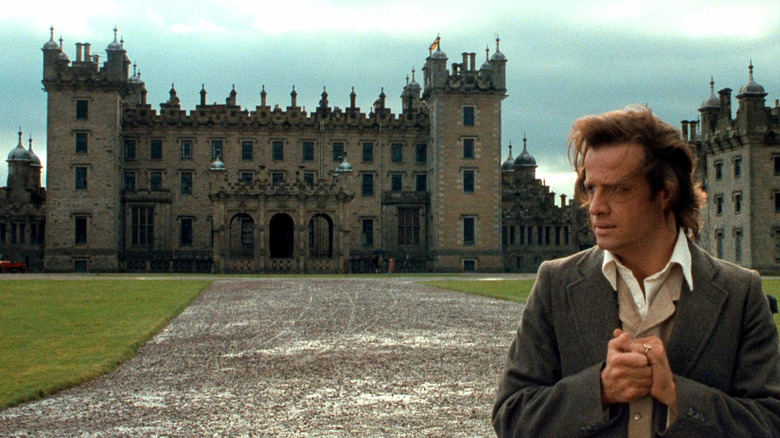Tarzan in a suit in front of Greystoke mansion in Greystoke: The Legend of Tarzan, Lord of the Apes