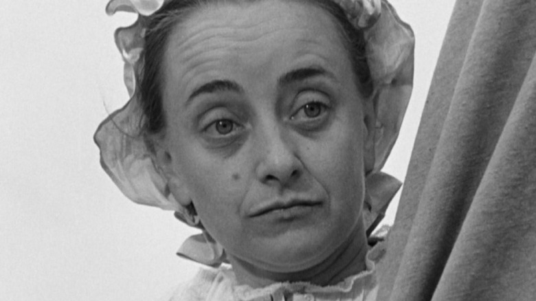 A woman wearing a nightcap in Westward the Women