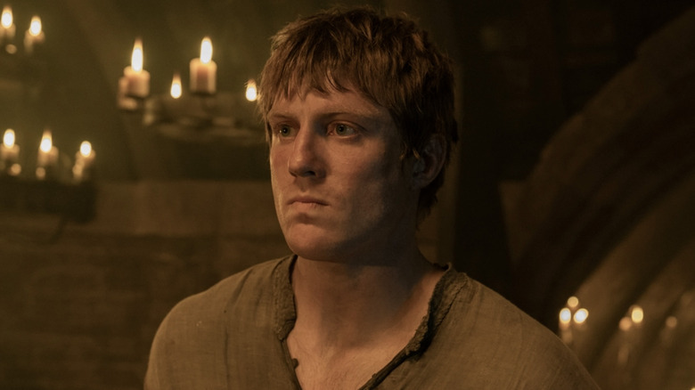 Ser Duncan the Tall looking solmen surrounded by candles in A Knight of the Seven Kingdoms