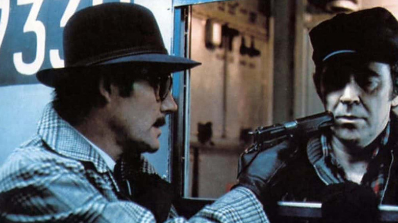 Robert Shaw's Mr Blue holding up the train driver in The Taking of Pelham One Two Three