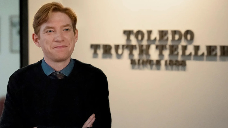 Ned standing in front of the Toledo Truth Teller office talking to the camera on The Paper