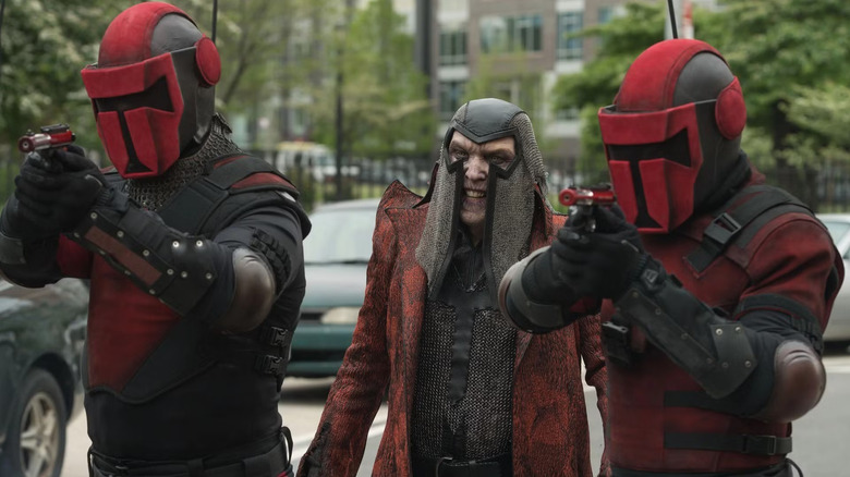 The Terror with two armed masked guards in The Tick