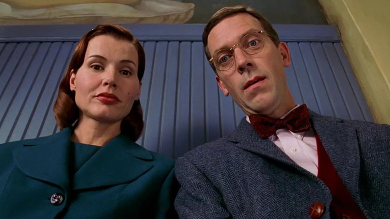 Eleanor and Frederick Little looking down at something in Stuart Little