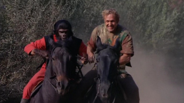 Roddy McDowall as Galen and Ron Harper as Alan riding horses in the Planet of the Apes TV show