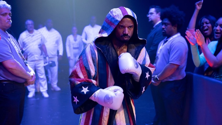 Creed III Adonis in American flag robe entering the ring