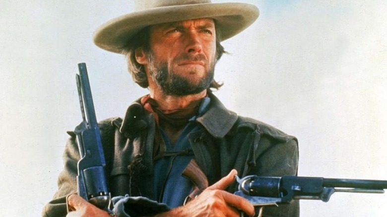 Josey Wales holding his guns in The Outlaw Josey Wales