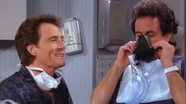 Tim talking while Jerry puts a gask mask on