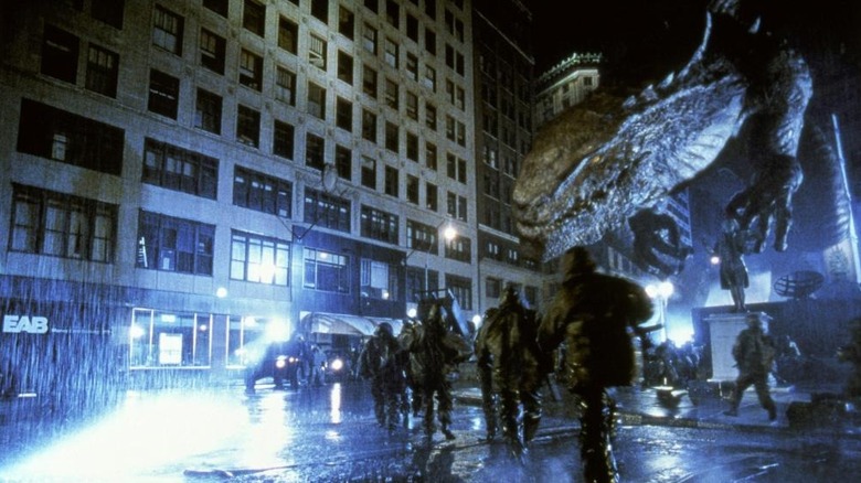 Zilla chasing soldiers down the street in Godzilla (1998)