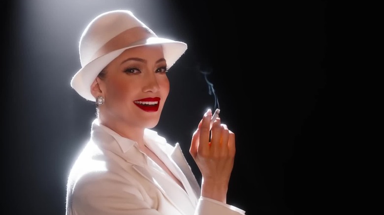 Jennifer Lopez is aglow with a cigarette in Kiss of the Spider Woman