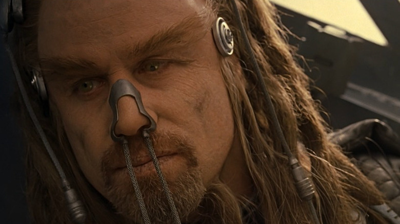 Terle John Travolta is looking forward to his left in the battlefield
