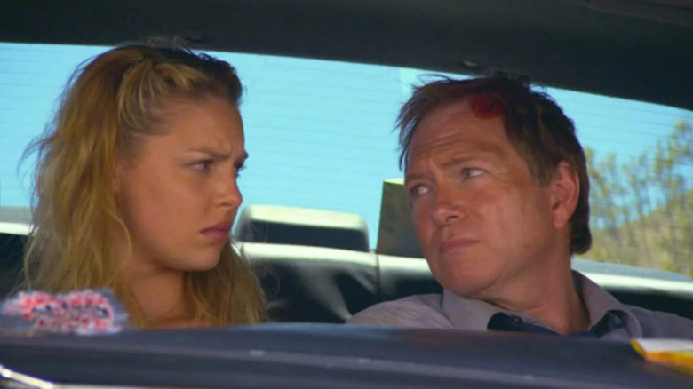 Marissa and Grant (with a bloodied head) in a car in Zyzzyx Road