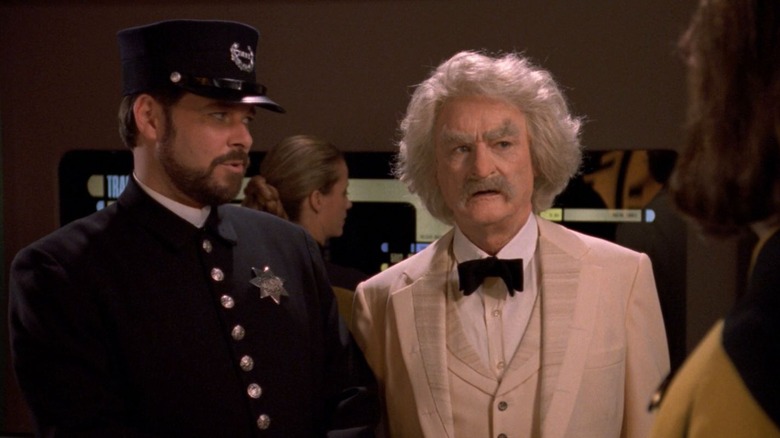 Commander Riker in a constable uniform and Mark Twain looking at Worf on Star Trek: The Next Generation