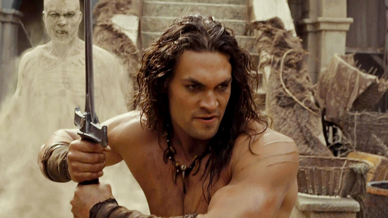 Conan holding a sword in Conan the Barbarian (2011)