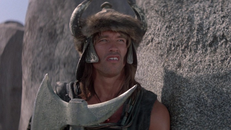 Conan wearing a horned helmet while praying to Crom in Conan the Barbarian (1982)
