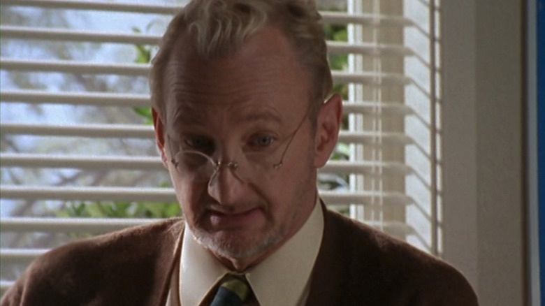 Robert Englund as Mr Bell is seen against a classroom blind in The Nightmare Room