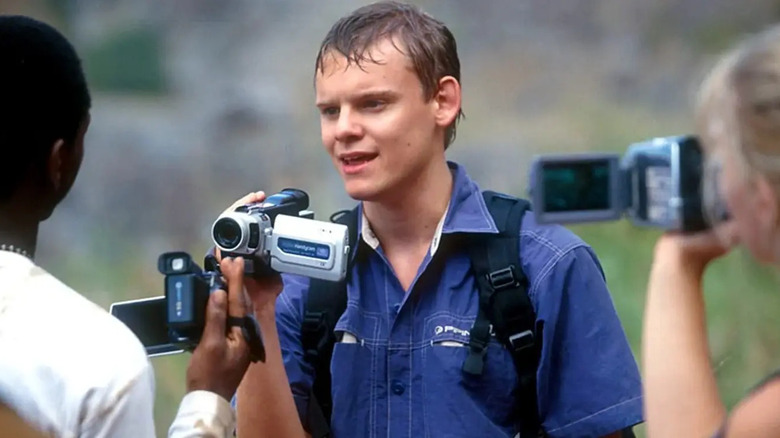 Simon Tudor holding a camcorder on Jeopardy