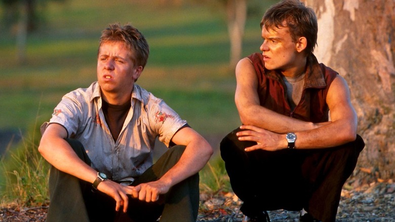 Harry and Simon sitting on the ground in Jeopardy